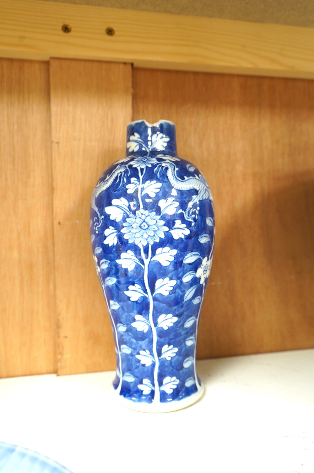 Two Chinese porcelain vases including a crackle glaze example and two plates, largest 23cm high. Condition - poor to fair